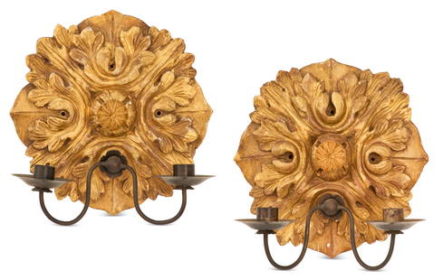 Pair of Italian Giltwood and Metal Sconces: Pair of Italian Giltwood and Metal Sconces 20th century, the medallion-form giltwood backplates carved with leaves, each set with a pair of scrolled candle arms terminating in drip pans and candle