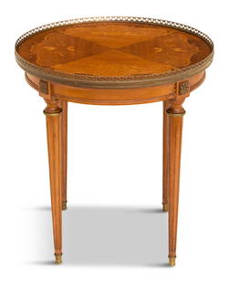 French Inlaid Mahogany Occasional Table: French Inlaid Mahogany Occasional Table 20th century, the circular, floral-inlaid top with a pierced brass gallery, and raised on turned, fluted and tapered circular legs. h. 20", dia. 22" 