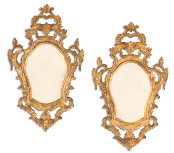 Pair of Small Italian Giltwood Mirrors: Pair of Small Italian Giltwood Mirrors first quarter 20th century, the shield-form mirrors set into giltwood surrounds decorated with pierced scrollwork and rocaille work. h. 28", w.
