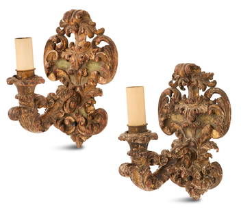Pair of Italian Carved Giltwood Sconces: Pair of Italian Carved Giltwood Sconces fourth quarter 19th century, the boldly carved sconces with shield-form backplates carved with scrollwork and leaves on an olive green ground, set with