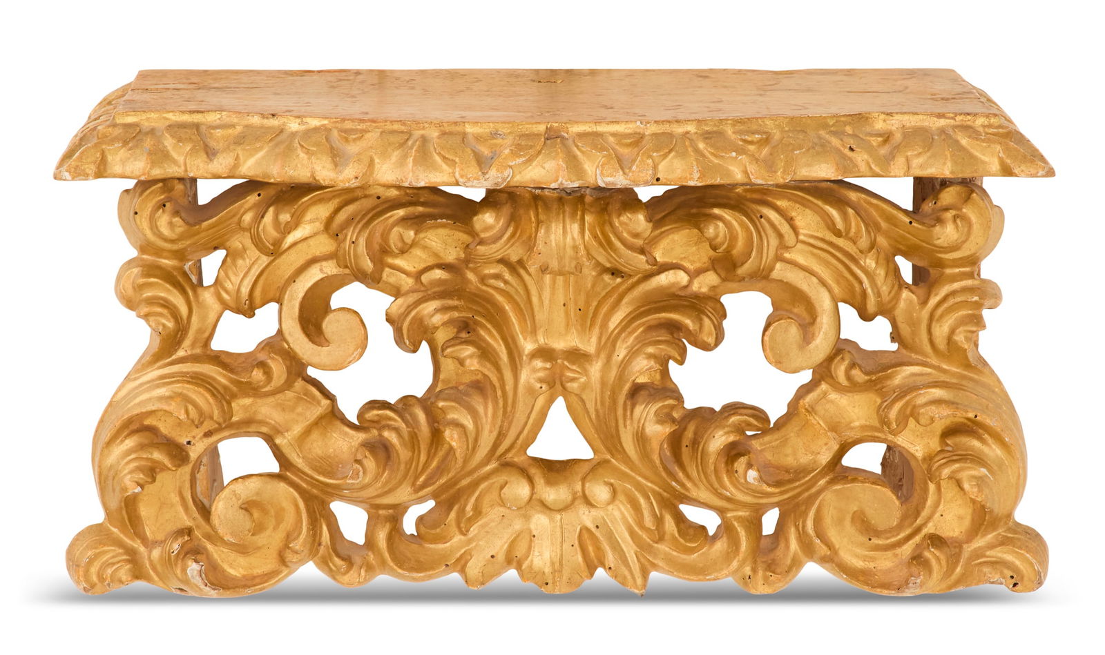 Italian Giltwood Console Bracket: Italian Giltwood Console Bracket19th century, in the Baroque taste, the serpentine shelf with a carved edge, the support composed of carved and pierced scrollwork.h. 10-3/4", w. 20-1/2", d.