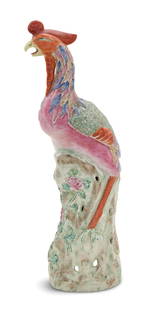 Chinese Export Porcelain Phoenix: Chinese Export Porcelain Phoenix early 20th century, Republic Period, the standing polychrome phoenix on a base molded with pink peonies and green leaves. h. 18", w. 5-1/2", d. 5-1/4" 
