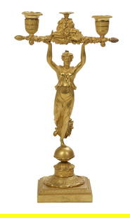 French Empire Gilt-Bronze Figural Candelabrum: French Empire Gilt-Bronze Figural Candelabrum first quarter 19th century, modeled with a figure of "Victory" supporting grape-molded candle cup holders. h. 13-1/2", w. 7-1/4", d.