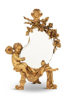French Giltwood Figural Boudoir Mirror: French Giltwood Figural Boudoir Mirror ca. 1900, the top in the form of an easel with a carved monogram, the beveled mirror plate in the form of an artist's palette, secured by a carved spray of
