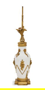 Gilt-Bronze and Blanc de Chine Lamp: Gilt-Bronze and Blanc de Chine Lamp first quarter 20th century, the blanc de chine porcelain vase mounted with a pair of sockets, set into gilt-bronze leaf-molded shade holders, the body mounted with