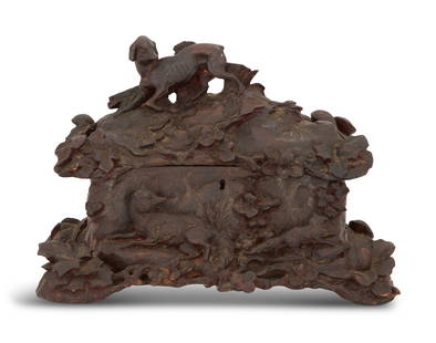 "Fox and Hound" Black Forest Jewel Casket: Charming Black Forest "Fox and Hound" Jewel Casket 19th century, with a hound on the cover and a fox on the base, against a lush carved ground of ivy leaves. h. 9", w. 13", d.