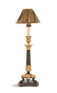 Restauration Bronze Dore et Patine Candlestick: Restauration Bronze Dore et Patine Candlestick second quarter 19th century, the faux candle with a brass candle chaser/shade holder, with a Fortuny-covered shade hung with gilt passamenterie fringe,