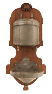 French Pewter, Brass and Walnut Lavabo: French Pewter, Brass and Walnut Lavabothird quarter 18th century and later, the serpentine pewter lidded cistern with spear-point finials and brass spigots, with a matching tapered pewter base, mounte