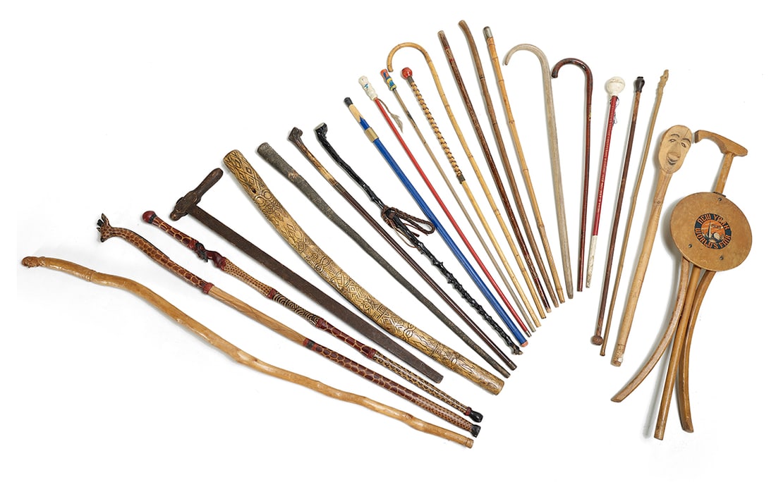 Collection of Walking Sticks and Staves: Collection of Walking Sticks and Stavesthe 77-piece collection including folk art canes, walking sticks and African spears.l. 25" to 73" Provenance: From the collection of Ambassador Richard