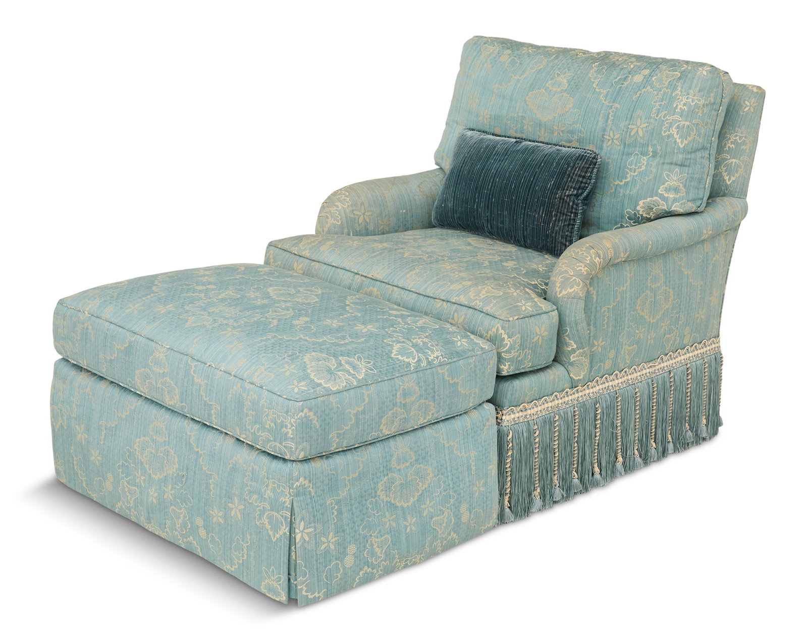 Scalamandre-Covered Club Chair and Ottoman: Scalamandre-Covered Club Chair and Ottoman the chair with a straight back, tightly rolled arms and conforming loose back and seat cushions, the skirt with elaborate gimp, tassels and deep fringe, the 
