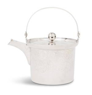 Japanese Silver Teapot: Japanese Silver Teapot Taisho or early Showa period, of bucket form, with hinged spout cap, shallow domed lid with melon finial, and swing strap handle, decorated all over with incised foliate