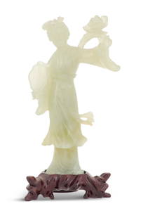 Chinese Carved Jade Figure of a Dancer: Chinese Carved Jade Figure of a Dancer 20th century, the dancing figure with a fan in one hand and a bouquet in the other, on a carved hardwood stand. h. 7-3/4", w. 4", d. 2"