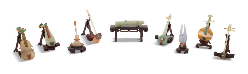 Chinese Carved Hardstone Musical Instruments: Chinese Carved Hardstone Musical Instruments 20th century, the nine-piece collection carefully executed and on carved hardwood stands, composed of several hardstones, including jade, agate,