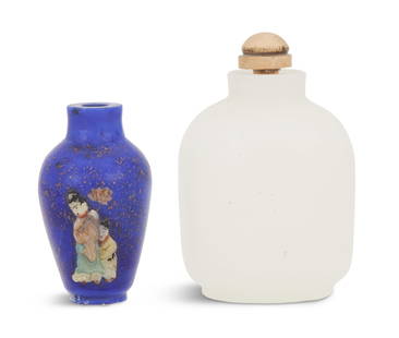 Two Chinese Snuff Bottles: Two Chinese Snuff Bottles one a plain white glass bottle imitating jade and the other a blue goldstone example with hardstone embellishment of a woman holding a lotus with a child by her side. h.
