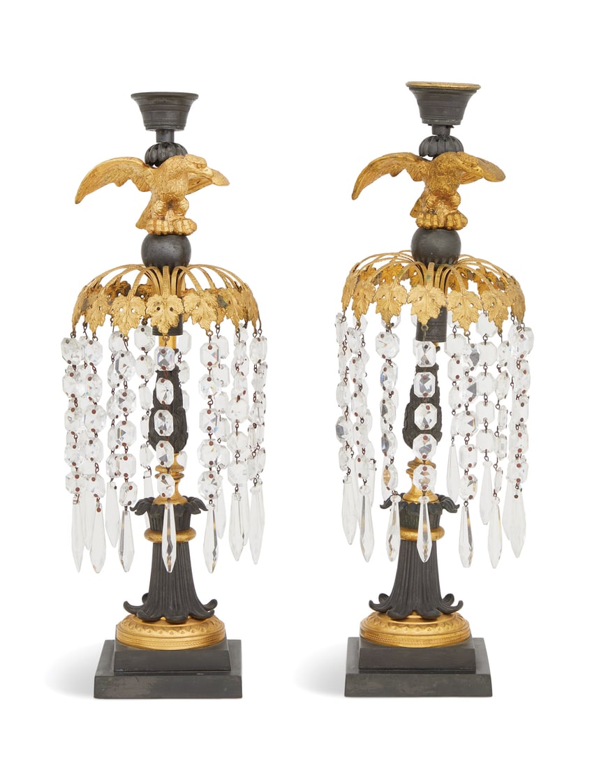 Pair of Regency Bronze Lustres: Pair of Regency Bronze Lustres early 19th century, in the manner of Thomas Messenger, the tapered and turned candle sockets atop gilt-bronze eagles, perched on spherules, raised above grape-leaf-molde
