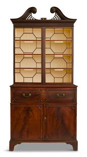 George III Mahogany Secretary Bookcase: George III Mahogany Secretary Bookcasefourth quarter 18th century, the broken swan's-neck pediment above a fluted and dentillated frieze, above two astragal-glazed doors, the lower section fitted with