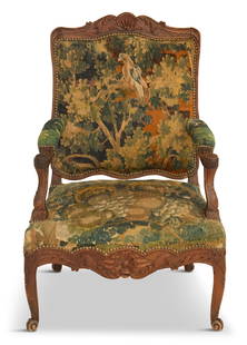 Regence Fruitwood Fauteuil: Regence Fruitwood Fauteuilearly 18th century, the shaped and padded square back surmounted by a foliate shell crest, joined to the padded seat by like arms, raised above a foliate-carved apron on cabr