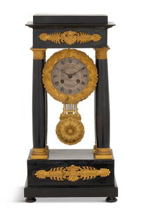 French Ebonized Portico Clock: French Ebonized Portico Clocksecond quarter 19th century, the Louis Philippe clock with handsome gilt-bronze mounts on the upper and lower case, the columns with engine-turned capitals and bases, the