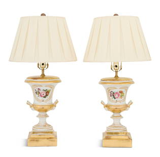 Pair of French Paris Porcelain Lamps: Pair of French Paris Porcelain Lampssecond quarter 19th century, the bases comprised of a pair of campana-form urns, decorated with rose bouquets in gilt wreaths, the handles with bisque ram's-head te