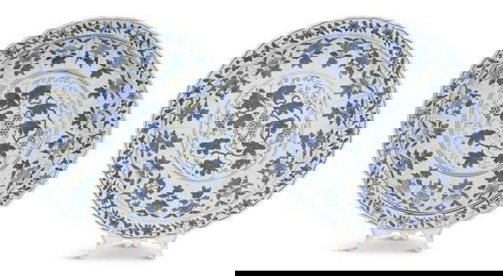 Pair of Chinese Kangxi-Style Dishes: Pair of Chinese Kangxi-Style Dishesthe blue-and-white dishes with central panels of grapes and grape leaves, the borders separated into panels decorated with various flowers, the bottoms with seal mar