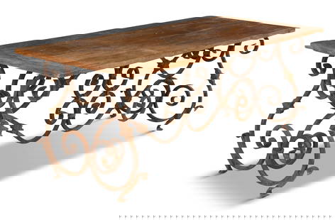 Oak and Wrought-Iron Guard Room Table: Oak and Wrought-Iron Guard Room Table20th century, the provincial table with a plank top, with breadboard ends, supported by a scrolled iron base.h. 29-1/2", w. 33-1/2", l. 80"