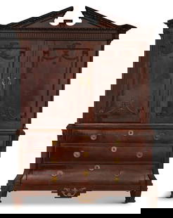 Dutch Mahogany Linen Press: Dutch Mahogany Linen Press18th century, the angled pediment with egg-and-dart-carved moldings, over a pair of paneled doors with applied swag carvings, the base with three long drawers and raised on f