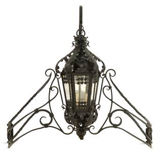 Impressive Black Metal Entry Light: Impressive Black Metal Entry Lightin the Mediterranean taste, the tapered, hexagonal lantern with spiral-turned corners, the glass sides with decorative grills, hanging from large scrolls and large ar