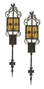 Pair of Iron and Stained Glass Exterior Lights: Pair of Iron and Stained Glass Exterior Lightsthe scrolled iron crowns over hexagonal lanterns set with amber and red stained glass, the corners set with rope-twist decoration, the matching standards