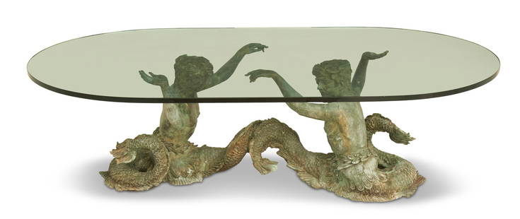 Figural Bronze and Glass Coffee Table: Figural Bronze and Glass Coffee Tablethe thick, oval plate-glass top supported by a pair of cast-bronze melusines.h. 19", w. 68", d. 39"