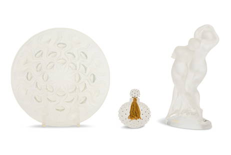 Three Pieces of Lalique Crystal: Three Pieces of Lalique Crystal20th century, including a "Bulbes No. 2" opalescent bowl, ca. 1935, with a stenciled mark, h. 2", dia. 9-3/4", a "Deux Danseurs" figure with the original label, h. 10",