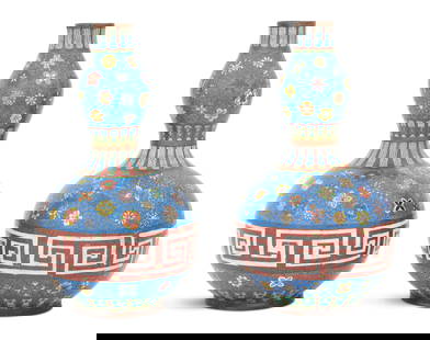 Pair of Chinese Cloisonne Double Gourd Vases: Pair of Chinese Cloisonne Double Gourd Vases20th century, the base decorated with a white fret border against a Chinese red ground, the remainder decorated with scattered polychrome flowers on a blue