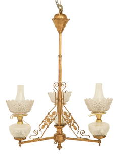 American Aesthetic Movement Chandelier: American Aesthetic Movement Chandelierfourth quarter 19th century, the three-arm chandelier with a brass frame, decorated with panels of aesthetic piercing and set with molded glass kerosene fonts, wi