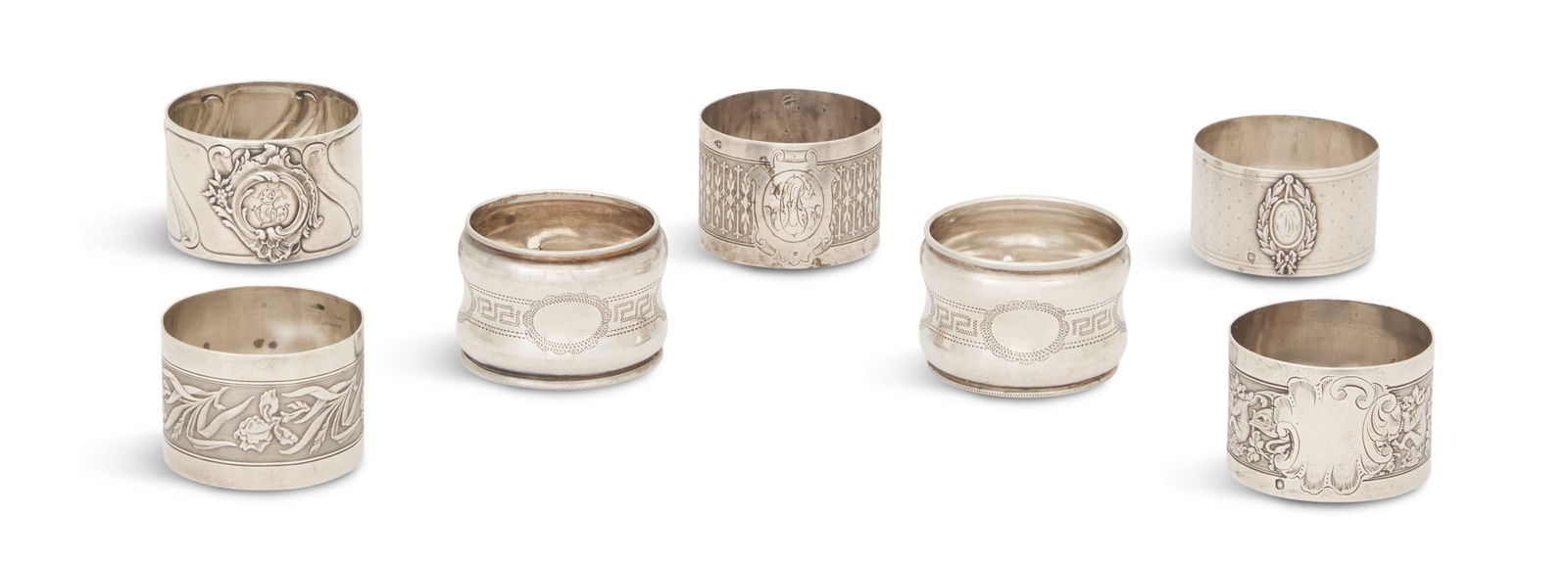 Seven French Belle Epoque Silver Napkin Rings: Seven French Belle Epoque Silver Napkin RingsParis, second half 20th century, first standard (.950) silver, by various makers: Adolphe Boulenger, Alphonse Debain, Ernest Compere, Guttin & Martinat, et