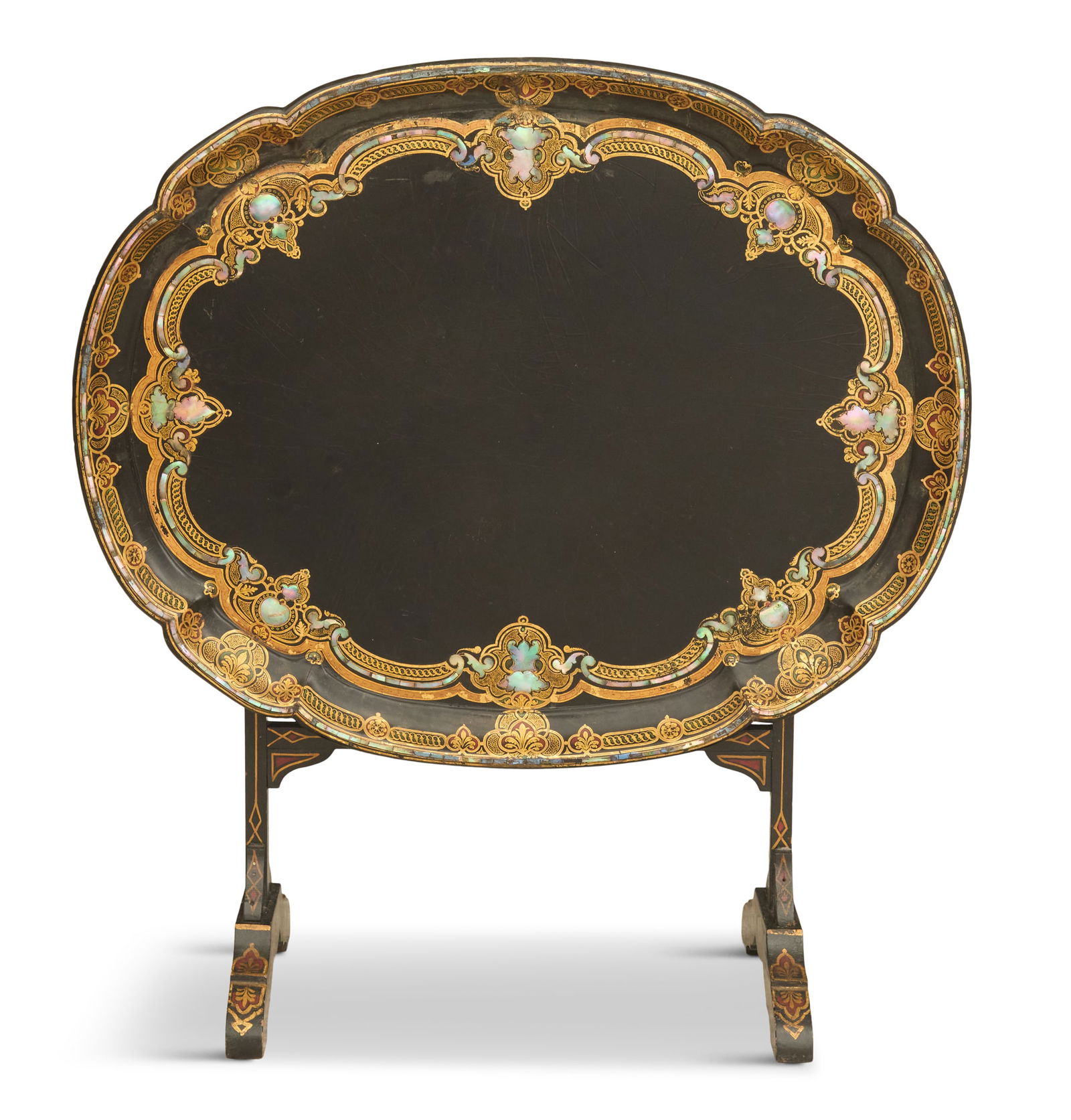 English Papier-Mache Folding Table: English Papier-Mache Folding Tablemid-19th century, the scalloped tray-form top decorated with gilt scrollwork and mother-of-pearl flourishes, mounted on a trestle-form wooden base, decorated to match