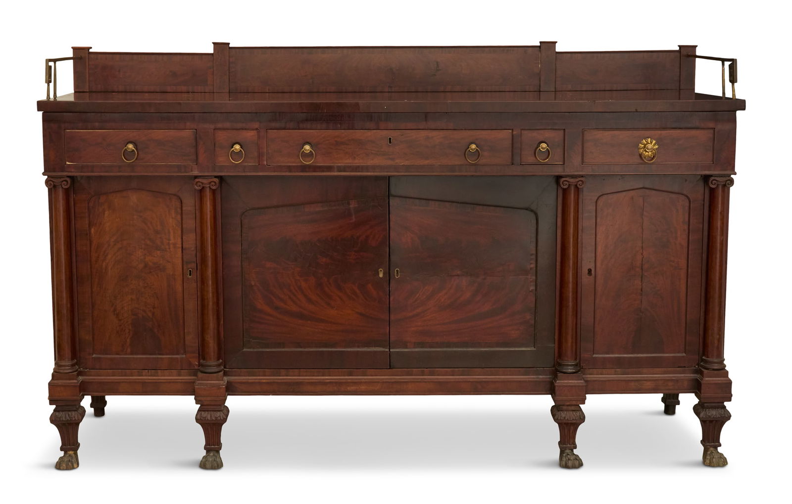 American Classical Mahogany Sideboard: American Classical Mahogany Sideboardfirst quarter 19th century, attributed to Duncan Phyfe, New York, with highly figured mahogany veneers throughout, the backsplash with brass side returns over a ro