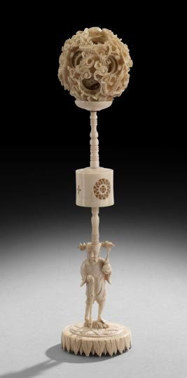 Chinese Ivory Puzzle Ball: Chinese Ivory Puzzle Ball, late 19th/early 20th century, with a caryatid plinth, h. 11".