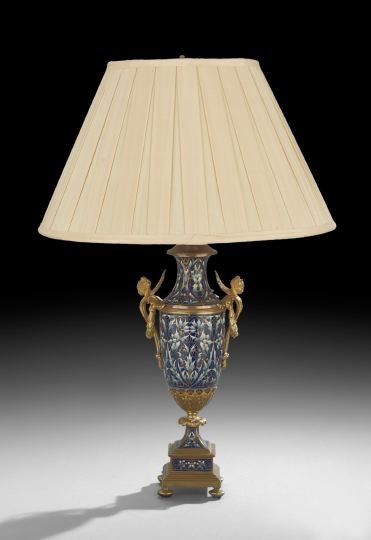 French Enamel and Gilt-Bronze Table Lamp: French Belle Epoque Champleve Enamel and Gilt-Bronze Table Lamp, ca. 1900, the blue ground champleve, mounted with pierced handles terminating in female masques, together with a shade, base, h. 13-1/2