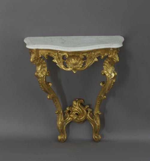 Louis XV-Style Marble-Top Console Table: Louis XV-Style Giltwood and Marble-Top Console Table, late 19th century, the shaped Carrara marble top with molded edge above a conforming pierced foliate shell frieze, raised on molded C-scroll legs 