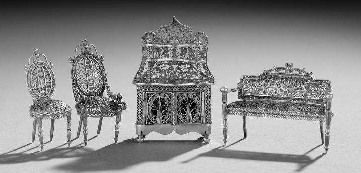 Four-Piece Silver Filigree Miniature Parlor Suite: Continental Four-Piece Silver Filigree Miniature Parlor Suite, first quarter 20th century, in the Louis XVI revival taste, including a settee, l. 2-1/4", a fauteuil, h. 2", a sidechair, h. 1-7/8", and
