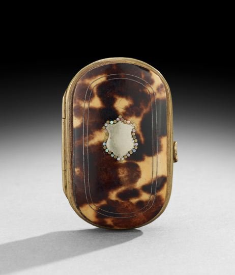 English Inlaid Tortoiseshell Coin Purse: English Inlaid Tortoiseshell Coin Purse, ca. 1900, the silver cover escutcheon outlined in mother-of-pearl rondels, the silk-lined interior compartmentalized, w. 2", d. 3".