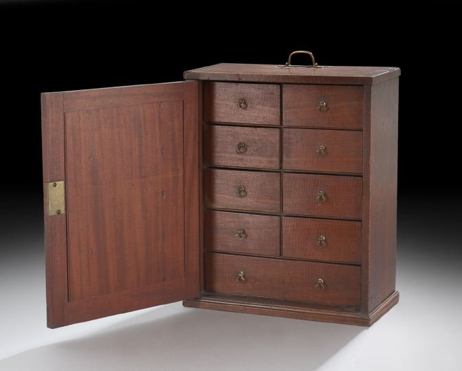 English Hepplewhite Inlaid Spice Cabinet: English Hepplewhite Inlaid Spice Cabinet, ca. 1800, the door inlaid with an oval and a diamond-shaped escutcheon, opening to reveal small spice drawers with brass knobs, the top framed in crossbanding