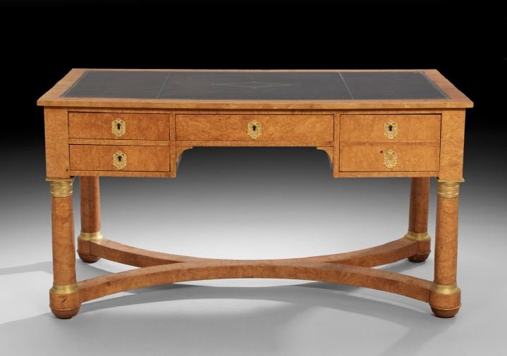Biedermeier Burl Elm Desk: Biedermeier Burl Elm Desk, mid-19th century, the rectangular top with an inset leather writing surface above a frieze fitted with a central drawer flanked to one side by two small drawers and to the o