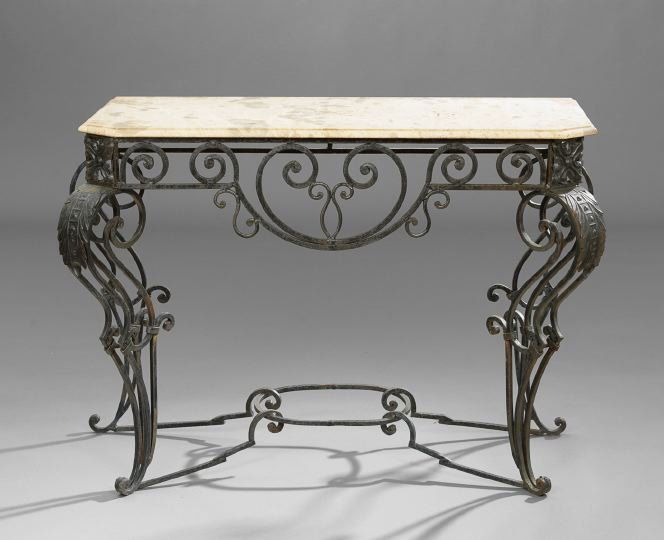 Wrought Iron and Stamped Metal Console Table: Wrought-Iron and Stamped Metal Console Table, the conforming travertine top with molded edge and resting on the scrolled base, h. 34", w. 48", d. 19".