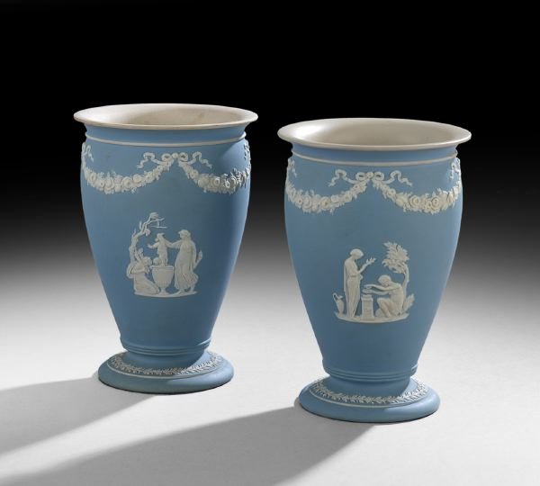 Pair of Wedgwood Jasperware Baluster Vases: Pair of Wedgwood Jasperware Baluster Vases, ca. 1900, the light blue ground decorated with neoclassical sprigging under floral garland borders held by bowknots, impressed "Wedgwood", h. 6", dia. 4-1/4