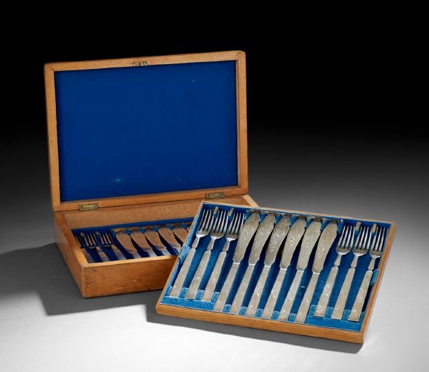Victorian Cased Silverplate Fish Service: Victorian Twenty-Four-Piece Cased Silverplate Fish Service, the design registered in 1879, by Martin, Hall & Co., Sheffield, including twelve fish forks, l. 7-1/2", and twelve fish knives, l. 8-1/4",