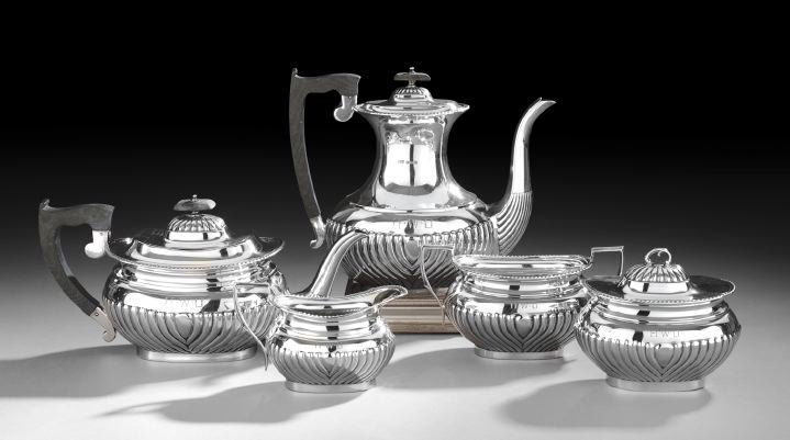 George VI Sterling Silver Five-Piece Tea Set: George VI Sterling Silver Five-Piece Tea Set, hallmarked Sheffield, 1945-1946, by Viner's, Ltd., in their "Georgian" pattern, including a coffeepot, l. 8-1/2", a teapot, l. 11-1/4", a covered sugar bo