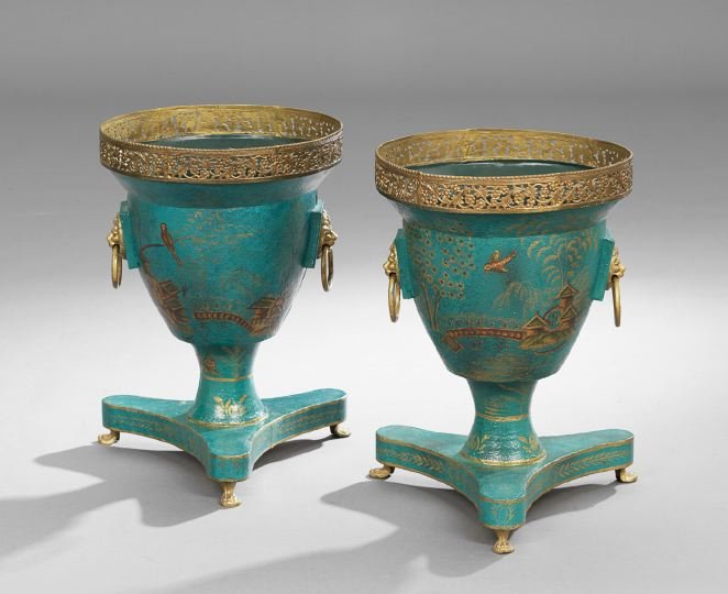 Pair of Regency Tole and Brass Wine Coolers: Pair of English Regency Tole and Brass Wine Coolers, first quarter 19th century, the tripartite bases supported on brass paw feet, the coolers set with brass lion's head ring pulls and a pierced brass