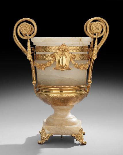 Large French Alabaster and Gilt-Bronze Urn: Large French Alabaster and Gilt-Bronze Urn, ca. 1900, the body decorated with a gilt-bronze molded cartouche, and swags and bands of laurel leaves, the ram's-horn handles mounted with medallions suppo