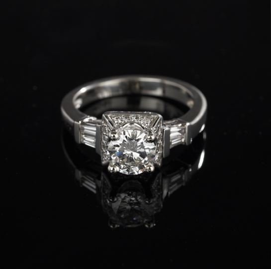 Eighteen-Karat White Gold and Diamond Ring: Eighteen-Karat White Gold and Diamond Ring, with a 1.83 carat round-cut diamond, G color and SI2 clarity, set in a raised gallery mounted with sixteen round-cut diamonds and flanked on either side of 
