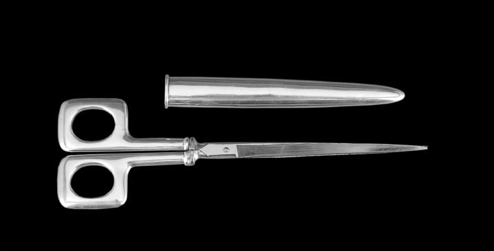 American Sterling Silver Desk Scissors: American Sterling Silver Desk Scissors, first quarter 20th century, by J. F. Fradley & Co., New York, New York, with square eye-rings, conical scabbard and narrow steel blades, l. 9-3/4", 1.02 t. oz. 